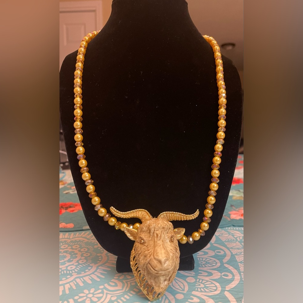 30” long pearl and crystal necklace with a pendant of Luca Razza